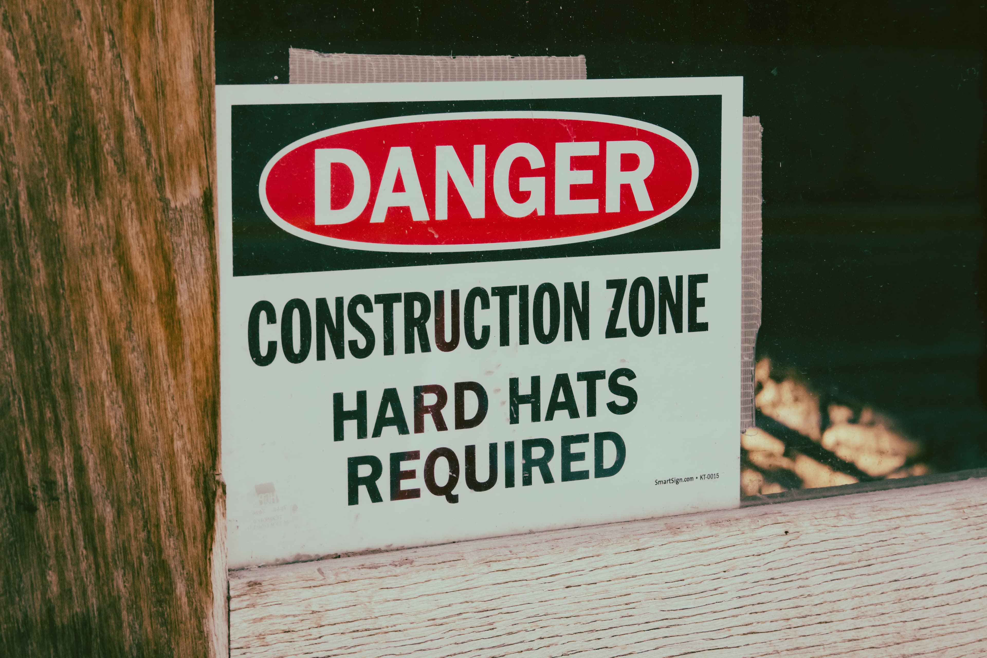 Engineer conducting workplace safety inspection with checklist in industrial setting